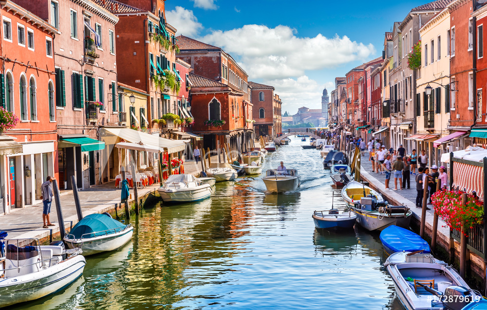Island murano in Venice Italy. View on canal with boat