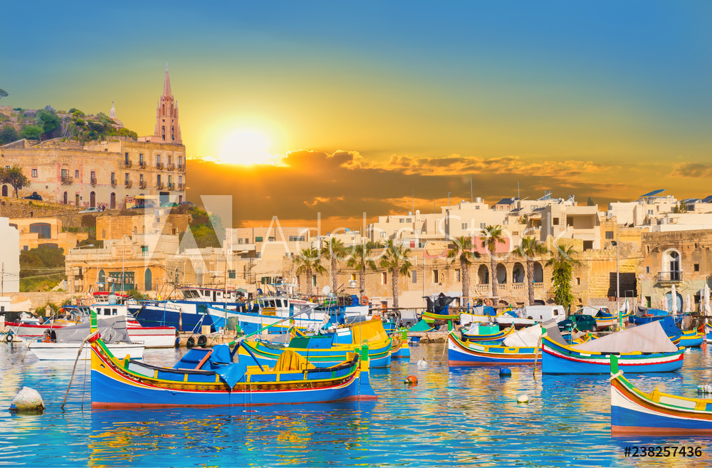 Obraz na płótnie Marsaxlokk village harbor of Malta, illuminate by sunset light w salonie