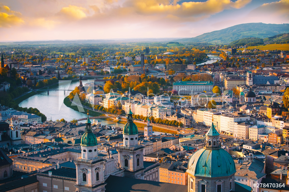 Obraz na płótnie Beautiful of Aerial panoramic view in a Autumn season at a historic city of Salzburg with Salzach river in beautiful golden evening light sky and colorful of autumn at sunset, Salzburger Land, Austria w salonie