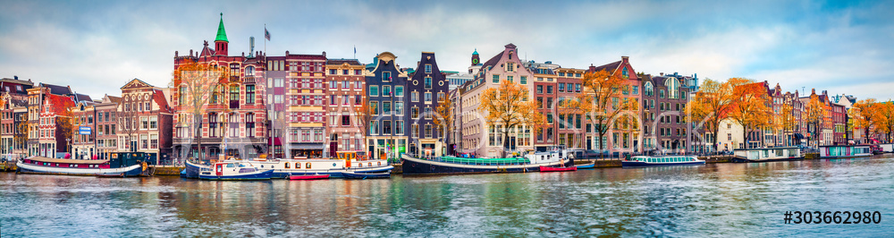 Obraz na płótnie Panoramic autumn view of Amsterdam city. Famous Dutch channels and great cityscape. Colorful morning scene of Netherlands, Europe. Traveling concept background. w salonie
